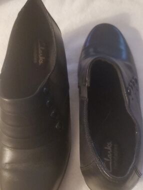 Clarks Black Leather Comfort Slip-Ons with Button Detail